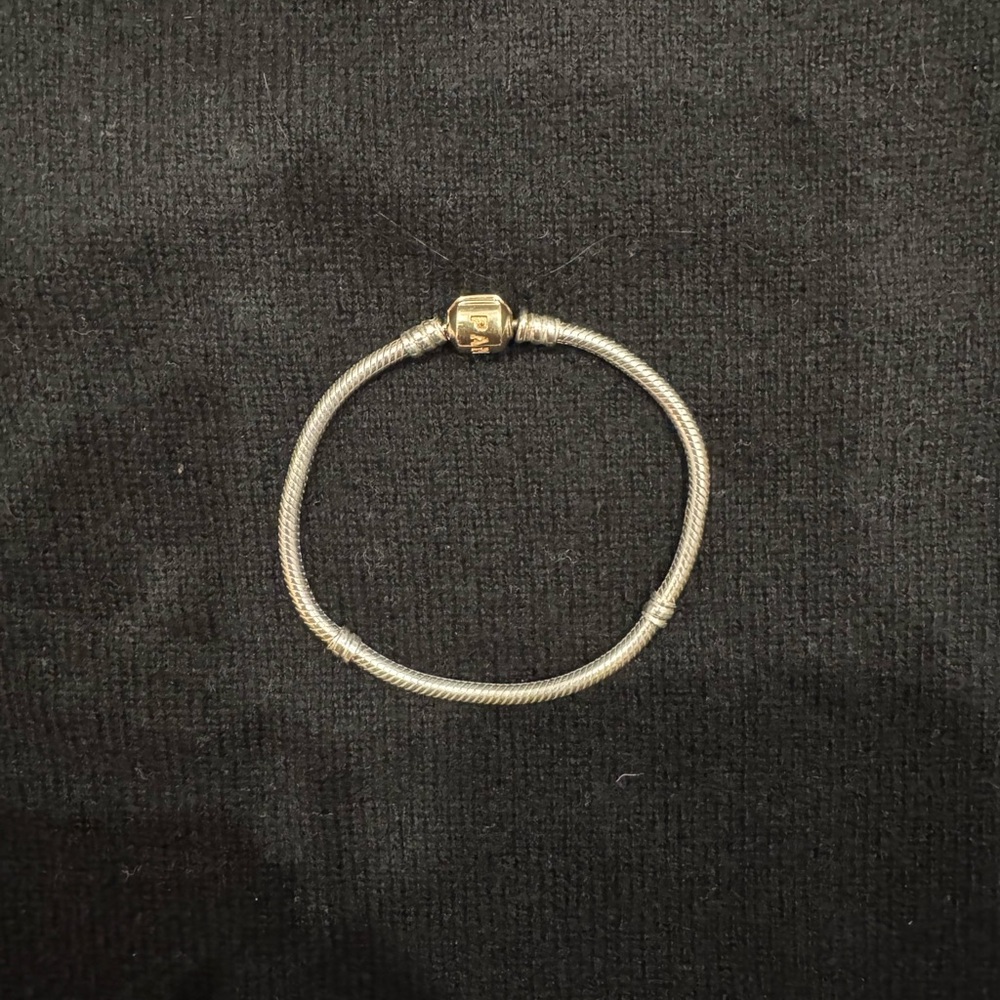 Pandora Silver Bracelet with Gold Clasp- 7” in length. Gently pre-used.